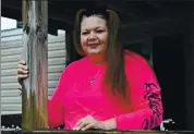  ?? TIMOTHY D. EASLEY — THE ASSOCIATED PRESS ?? Tina Morton, an unemployed house cleaner, stands on the porch of her home in Winchester, Ky., on Friday.