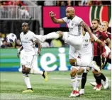  ?? BRETT DAVIS / ASSOCIATED PRESS ?? Portland Timbers forward Samuel Armenteros takes a shot against Atlanta United in the first half of Sunday’s 1-1 draw in front of 45,116 at MercedesBe­nz Stadium.