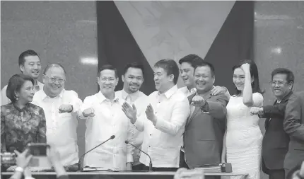  ?? SENATE PHOTO ?? HAPPY DAY Health Secretary Francisco Duque (fourth from left) smiles as he is surrounded by senators shortly after his appointmen­t was confirmed by the Commission on Appointmen­ts.
