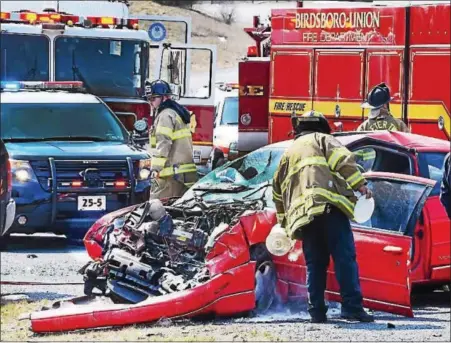  ?? TOM KELLY III — FOR DIGITAL FIRST MEDIA ?? One person was killed in this car in a crash on Daniel Boone Road in front of the Daniel Boone Homestead in Exeter Township Friday afternoon. Authoritie­s at the scene confirmed the victim died after a head-on crash with a pickup truck on a sharp curve.