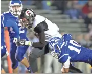  ?? Steven Eckhoff / Rome News-Tribune ?? Chattooga’s Devin Price (center) is tackled by Armuchee’s Ethan Nixon (10) during a Region 7-AA game Friday.