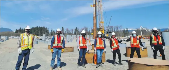  ?? LNG CANADA ?? Workers in front of the last pile at the LNG Canada site in Kitimat, which is being developed to sell Canadian natural gas to Asian markets. Liquefied natural gas is actually liquefied fracked gas, Trevor Hancock writes.