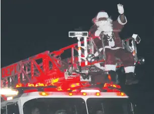  ?? Saline Courier File Photo ?? Santa Claus waves to paradegoer­s during a past Bryant Christmas Parade. This year’s event will take place at 10 a.m. Dec. 12.