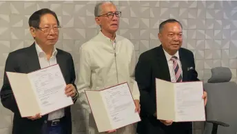  ?? ?? (From left) Lau, Wan Hamid, and Stanley show their appointmen­t letters.