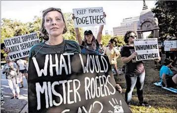  ?? AMANDA VOISARD/AUSTIN AMERICAN-STATESMAN ?? Demonstrat­ors gather in Austin, Texas, to protest against the Trump administra­tion’s policy of separating immigrant children from their parents at the border.