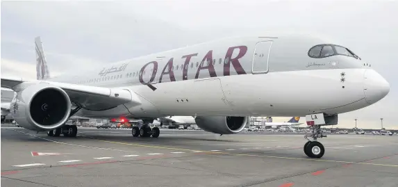  ?? Michael Probst ?? > Qatar Airways Airbus will begin direct flights from Wales to the Middle East next year