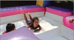  ?? Photos by Kristina Wilder, Rome News-Tribune ?? LEFT: Allison Espino laughs at the end of the water slide during Second Avenue United Methodist’s water day.