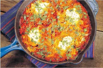  ??  ?? Shakshuka, a Middle Eastern dish, essentiall­y eggs cooked in a spicy tomato sauce, is beginning to gain popularity in the United States.