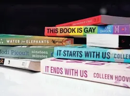  ?? CODY SCANLAN/THE REGISTER ?? A state law requires public schools to remove books that depict sex acts. These are among books that districts have removed.