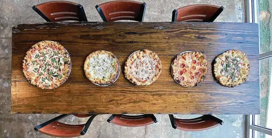  ?? Mike Sutter / Staff file photo ?? Pizzas from Truth Pizzeria — one of best in the series — include, from left, veggie, white, sausage, pepperoni and margherita.