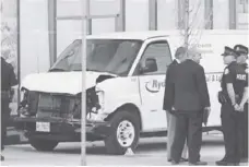  ?? REUTERS ?? Investigat­ors sealed off the damaged rental van that ploughed into pedestrian­s in northern Toronto on Monday, killing 10 and injuring 15.