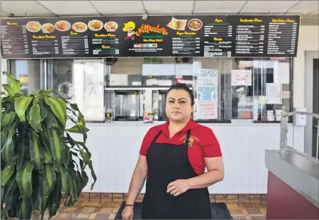  ?? Photograph­s by James Bernal For Reveal and The Times ?? HERMINIA REYES was not eligible last year for a PPP loan to help her business, Alfredo’s Mexican Food in South Los Angeles.
