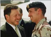  ?? YOUSEF ALLAN — THE ASSOCIATED PRESS FILE ?? Jordan’s King Abdullah II laughs with his half brother Prince Hamzah, right, shortly before the monarch embarked on a tour of the United States on April 2, 2001.