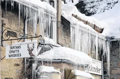  ?? PHOTO: GETTY IMAGES ?? Brrrutal . . . Icicles hang from the roof of a shop in Braemar, Scotland, yesterday. A low of 23degC was recorded in the Scottish Highlands by the Met Office on the coldest night since 1995.