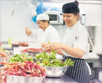  ??  ?? Dana McDonald, EIT Learning Facilitato­r, leads students prepping for the Hawke's Bay Wine Awards dinner at EIT's Taradale bakery ).