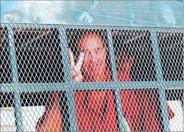  ?? PHA LINA ?? Australian filmmaker James Ricketson is taken away from the Phnom Penh Municipal Court in a prison transport vehicle earlier this month.