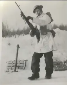  ??  ?? Trooper John Ivor Griffin from Swift Current served with the 8th Reconnaiss­ance Regiment (14th Canadian Hussars) during the Second World War. He is pictured at Camp Borden with a Bren light machine gun during training in the winter of 1942.