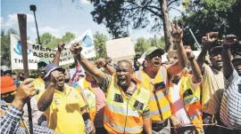  ??  ?? MAKING A POINT. Taxi drivers on the way to deliver a memorandum to the department of transport yesterday.