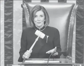  ?? REUTERS/Jonathan Ernst ?? U.S. Speaker of the House Nancy Pelosi (D-CA) wields the gavel as she presides over the House of Representa­tives approving two counts of impeachmen­t against U.S. President Donald Trump in the House Chamber of the U.S. Capitol in Washington, U.S., December 18, 2019.