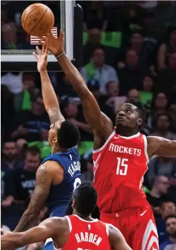  ?? (Reuters) ?? HOUSTON ROCKETS center Clint Capela (15) blocks the shot of Minnesota Timberwolv­es guard Jeff Teague in the first quarter of the Rockets’ 119-100 road victory on Monday night to take a 3-1 lead in the teams’ Western Conference first-round playoff series.