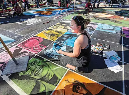  ?? THE CALIFORNIA­N / FILE ?? For the 20th anniversar­y of the Via Arte Italian Street Painting Festival in 2018, Ridgeview High art teacher Robyn Dyer created a work depicting 20 influentia­l women. More than 100 artists will take to the asphalt at The Marketplac­e this weekend for the 22nd annual event.