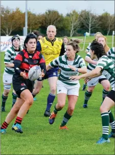  ??  ?? Arklow’s Emily Slater is tracked by Leah O’Doherty of Greystones.