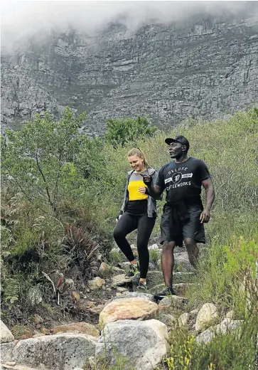  ?? Pictures: RUVAN BOSHOFF ?? KEEN ON EXERCISE: Maybe Corpaci trains with Jose Maria Joao, who runs on Table Mountain and Lion’s Head. People sometimes can’t pay him, but he still insists on ’first breakfast’, a run up the mountain