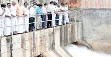  ??  ?? Animal Husbandry Minister ‘Udumalai’ K Radhakrish­nan releasing water from Amaravathi dam in Tirupur district