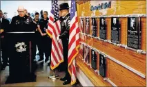  ?? TERRY/ THE OKLAHOMAN] ?? Oklahoma County sheriff's office Chaplain Doug McLerran leads a prayer during the dedication of the sheriff's office memorial wall inside the Oklahoma County Jail in Oklahoma City on Friday. [BRYAN