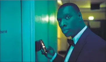  ?? NETFLIX Emmanuel Guimier ?? in June launched an e-commerce website that sells Netf lix merchandis­e and products based on and inspired by shows including “The Witcher” and “Lupin.” Above, Omar Sy plays a gentleman thief in “Lupin.”