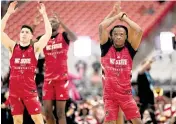  ?? ROBERT WILLETT rwillett@newsobserv­er.com ?? N.C. State’s D.J. Horne (0) and his teammates stretch during their open practice on Friday, April 5, 2024, as they prepare for their NCAA National Semi-Final game against Purdue at State Farm Stadium in Glendale, AZ.