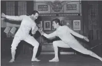  ??  ?? Luigi Carpaneda in sala di scherma con Edoardo Mangiarott­i alla Società del Giardino. Nel 1956 a Melbourne conquista l’oro nel fioretto a squadre.