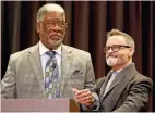  ?? ?? LEFT: Lynn Coleman, left, and Randy Kelly speak before Elizabeth Bennion, professor of political science and director of community engagement at Indiana University South Bend, receives the Roland Kelly Award.