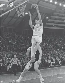  ?? AP PHOTO ?? LSU’s Pete Maravich flies through the air during the Tigers star’s recordbrea­king performanc­e to become college basketball’s leading scorer of all time on Feb. 1, 1970 in Baton Rouge.