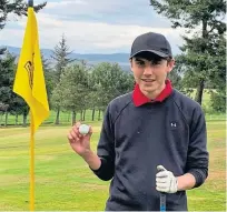  ??  ?? Teenager Adam Clark was delighted after hitting a hole in one at a par four at Kirriemuir Golf Club last week in the junior club championsh­ip. The 17-year-old – who is also a member at Carnoustie – aced the 270-yard seventh hole after taking a driver off the tee. Dad Fergus told Courier Sport: “It’s brilliant. He’s been playing since he was six years old. Doing it at a par four makes it even more special.”