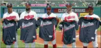  ?? RON SCHWANE — THE ASSOCIATED PRESS ?? Michael Brantley, Corey Kluber, Francisco Lindor, Yan Gomes and Jose Ramirez hold their All-Star jerseys before playing the Yankees on July 15 at Progressiv­e Field. Trevor Bauer was warming up for the game and is not pictured.