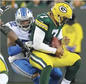  ?? MARK HOFFMAN / MILWAUKEE JOURNAL SENTINEL ?? Detroit safety Tavon Wilson sacks Green Bay quarterbac­k Brett Hundley during the fourth quarter.