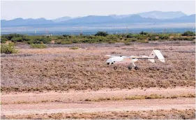  ?? COURTESY OF JOSH BACKMAN/NMSU ?? A drone lands during flight testing for the Federal Aviation Administra­tion. New Mexico State University hosted three days of testing in July at the Jornada Experiment­al Range to evaluate detect and avoid technologi­es.