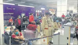  ?? BY ARRANGEMEN­T ?? Passengers and security personnel at IGI Terminal 3 in New Delhi on Saturday. n