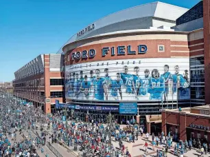  ?? JUNFU HAN/DETROIT FREE PRESS ?? Detroit Lions fans tailgate outside of the Ford Field in downtown Detroit in 2017.