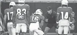  ?? ROB SCHUMACHER/THE REPUBLIC ?? Cardinals wide receivers coach David Raih works with players in training camp at State Farm Stadium this summer.