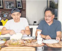  ?? CARLOS OSORIO TORONTO STAR ?? Wayne Reyes and his father, Wilfred Reyes, with the Filipino dish sinigang