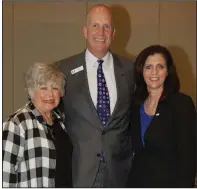  ??  ?? Carolyn Bazzel, mother of the honoree, with Jeff Hildebrand and Betsy Arnold of Fayettevil­le