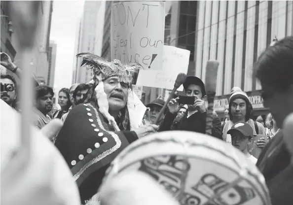  ?? CHRIS YOUNG / THE CANADIAN PRESS ?? Martin Louie in his days of leading protests against the Northern Gateway pipeline. Louie says he did not want to sink the project but was instead seeking a better deal for his community from Enbridge Inc. Today, Louie is backing the Eagle Spirit...