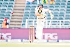  ??  ?? Australian batsman Tim Pain plays a shot on the third day of the fourth Test cricket match between South Africa and Australia won by South Africa at Wanderers cricket ground on April 1, 2018 in Johannesbu­rg, South Africa. - AFP photo