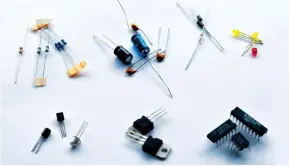  ??  ?? Top-right to bottom left, we can see resistors, capacitors, diodes, Light Emitting Diodes (LEDs), transistor­s, voltage regulators and integrated circuits (ICs)