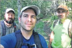  ?? contribute­d ?? Friend Scott Veinott and Trailblaze­rs’ sons Daniel d’Entremont and Roger Burrill take a photo during their hike down the old Annapolis road.