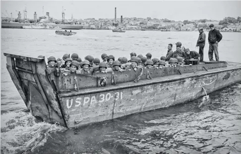  ?? National Archives ?? Some of these guys didn’t make it back. This is Boat 31 from the USS Thomas Jefferson (APA-30), an attack transport, and it’s loaded with 29th Infantry Division troops being ferried out to the ship in the days before the June 6, 1944, landing. A few days later, parts of the 29th Infantry Division landed on Omaha Beach, the bloodiest landing of the Normandy campaign. A total of 81 LCVPS were destroyed on D-day, 55 of them at Omaha Beach. It’s possible this boat was one of them.