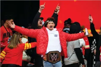  ?? AP PHOTO/REED HOFFMANN ?? On Feb. 15, Kansas City Chiefs Patrick Mahomes, wearing a WWE belt, celebrates the team’s Super Bowl victory at a gathering in Kansas City, Mo.