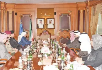  ??  ?? KUWAIT: Deputy Prime Minister and Interior Minister Sheikh Khaled Al-Jarrah Al-Sabah (center) is seen during a meeting of the board of the Central Apparatus for Illegal Residents Affairs yesterday. — KUNA